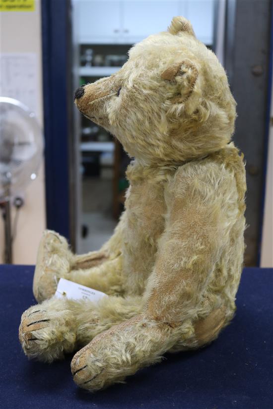 A Steiff centre seam bear, c.1908, replaced paw pads, hair loss to body, arms and legs, 20in. A Steiff centre seam bear, c.1908, replaced paw pads, hair loss to body, arms and legs, 20in.